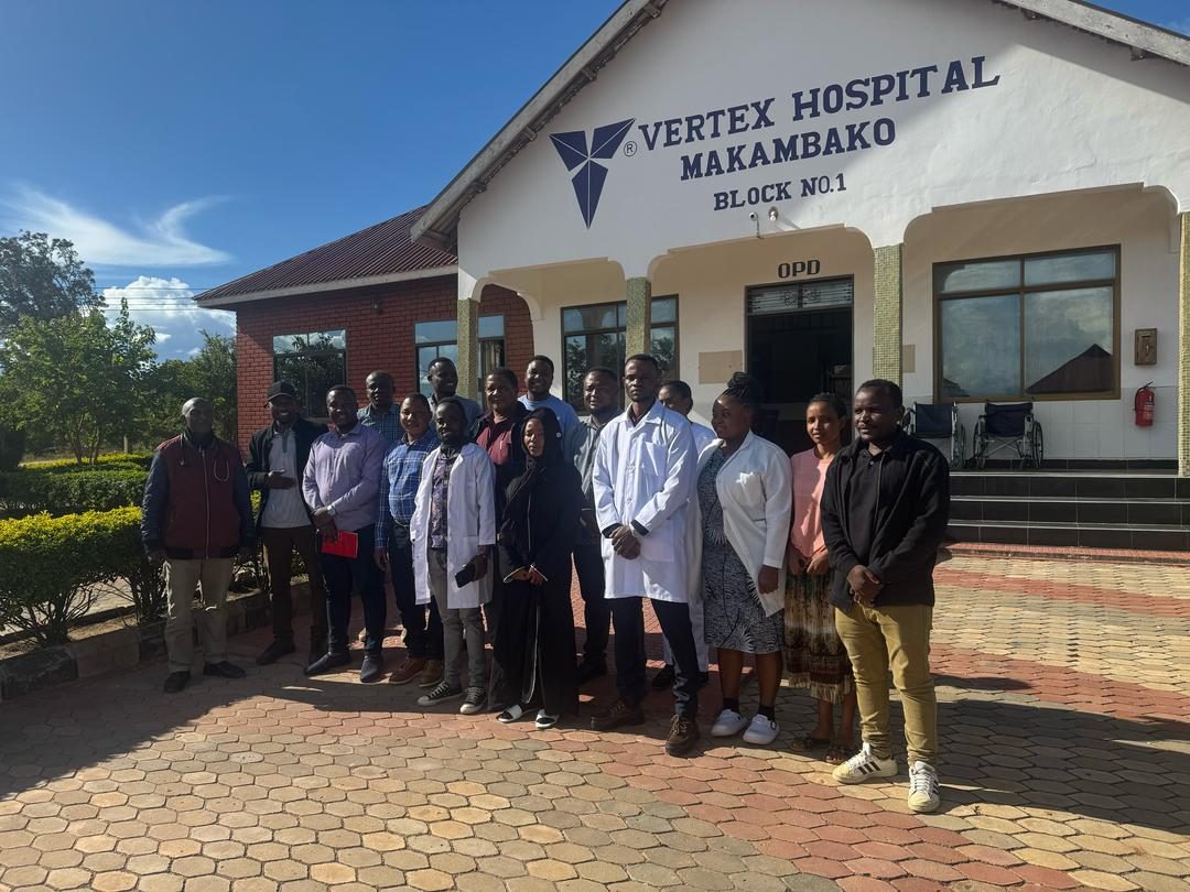Vertex Hospital Makambako staff at the hospital entrance